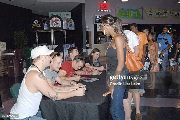 Todd Harrell, Matt Roberts, Brad Arnold, Chris Henderson and Greg Upchurch of 3 Doors Down sign autographs for fans during the GRAMMY Soundchecks...