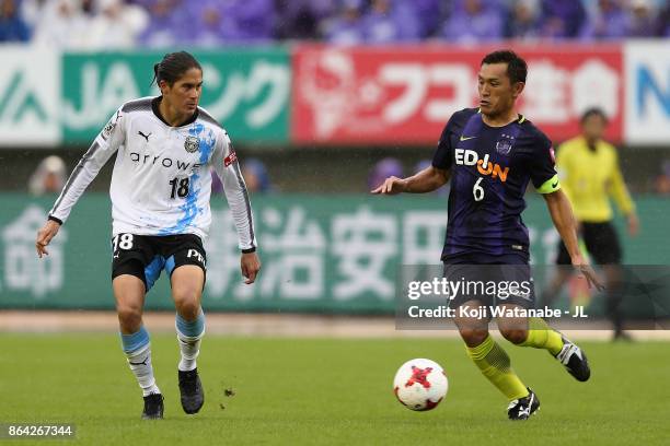 Toshihiro Aoyama of Sanfrecce Hiroshima takes on Elsinho of Kawasaki Frontale during the J.League J1 match between Sanfrecce Hiroshima and Kawasaki...