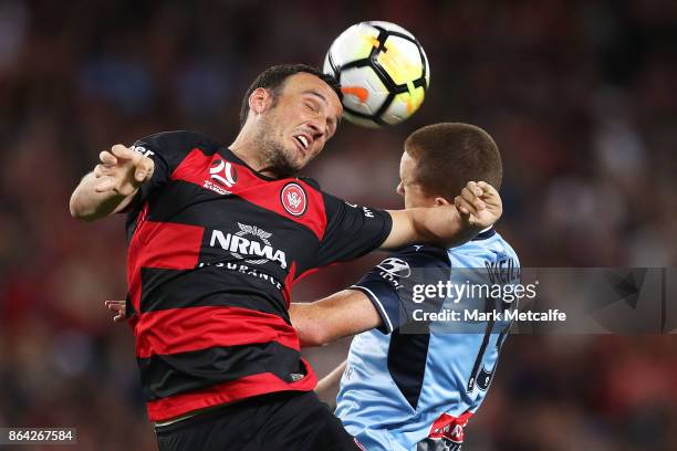 Mark Bridge of the Wanderers and Brandon O'Neill of Sydney FC compete for a header during the round three A-League match between Sydney FC and the...