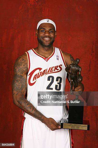 LeBron James of the Cleveland Cavaliers holds the 2008-2009 MVP Trophy May 5, 2009 in Cleveland, Ohio. NOTE TO USER: User expressly acknowledges and...