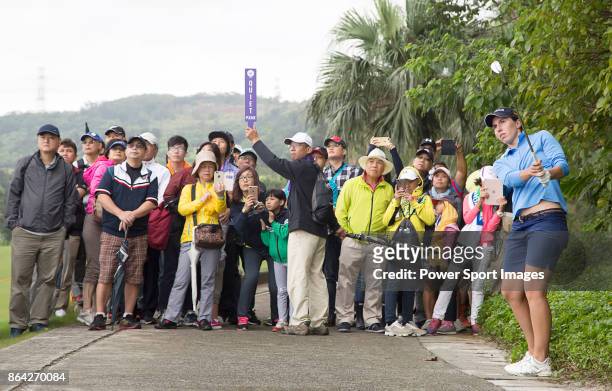 Carlota Ciganda of Spain hits a shot from a cart path next to the 4th fairway during day three of the Swinging Skirts LPGA Taiwan Championship on...