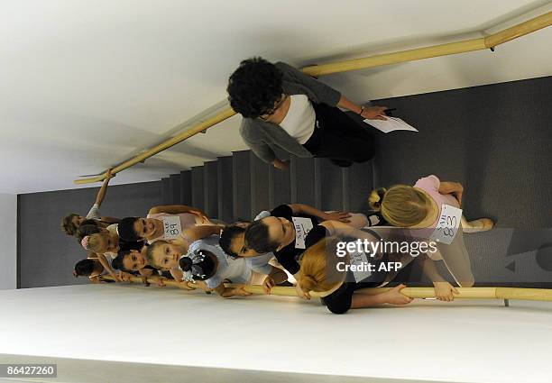 Young ballet students are taken up the stairs to the dance studio during auditions for 7 & 8 year olds for the School of American Ballet at Lincoln...