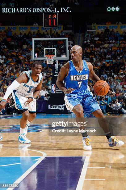 Chauncey Billups of the Denver Nuggets drives past Chris Paul of the New Orleans Hornets in Game Four of the Western Conference Quarterfinals during...