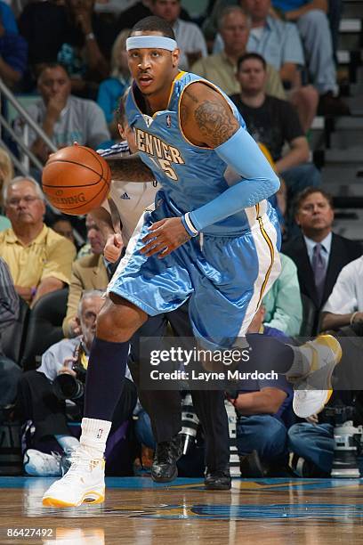 Carmelo Anthony of the Denver Nuggets drives the ball upcourt against the New Orleans Hornets in Game Four of the Western Conference Quarterfinals...