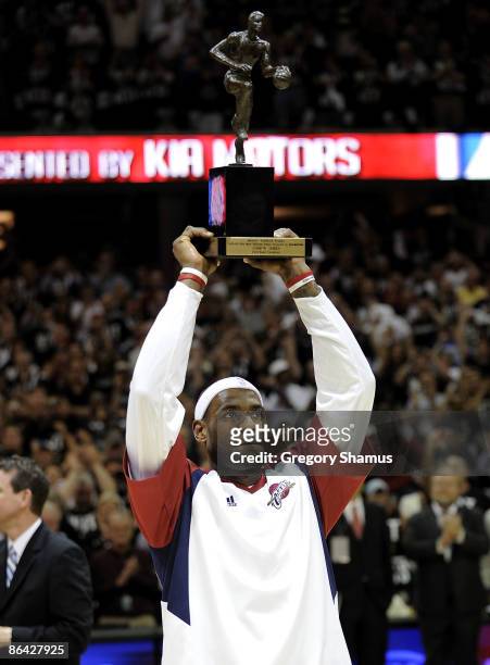 LeBron James of the Cleveland Cavaliers holds up the 2008-2009 MVP trophy prior playing the Atlanta Hawks in Game One of the Eastern Conference...