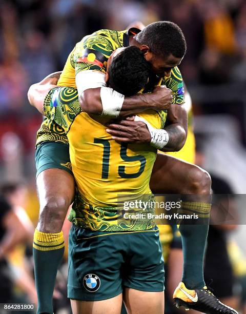 Marika Koroibete and Israel Folau of the Wallabies celebrate victory after the Bledisloe Cup match between the Australian Wallabies and the New...