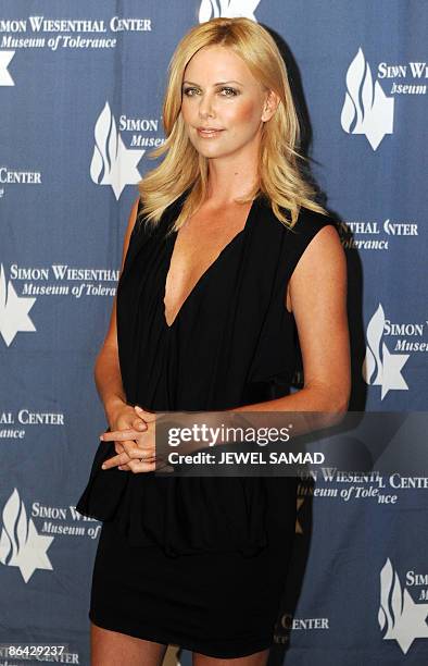 Actress Charlize Theron arrives for the Simon Wiesenthal Center 2009 National Tribute Dinner honoring actor Will Smith and Theron in Beverly Hills,...