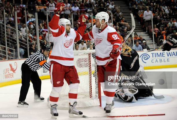 Henrik Zetterberg of the Detroit Red Wings celebrates with Johan Franzen after scoring on a power play against the Anaheim Ducks during Game Three of...