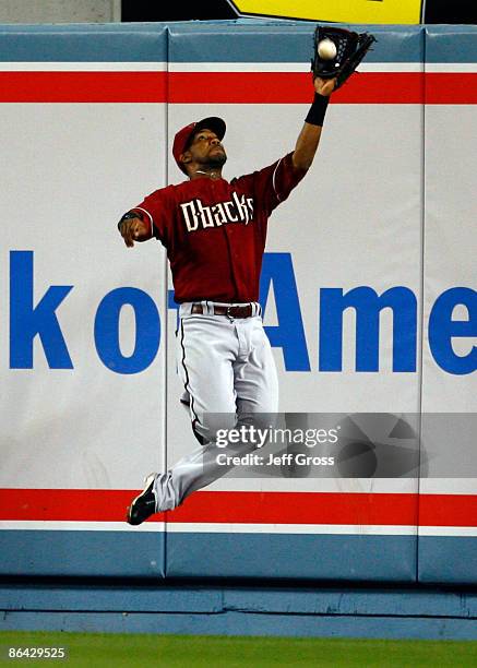 Center fielder Chris Young of the Arizona Diamondbacks catches a fly ball hit by Andre Ethier of the Los Angeles Dodgers in the fifth inning at...