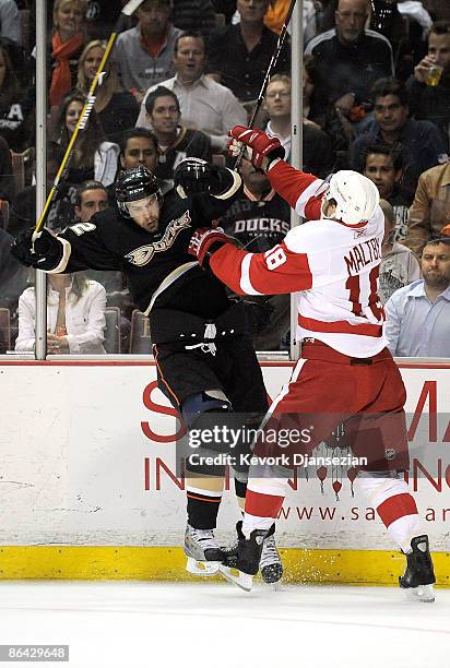 Josh Green of the Anaheim Ducks and Kirk Maltby of the Detroit Red Wings clash in the first period of Game Three of the Western Conference Semifinal...