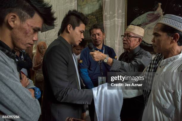 Paulo Mamayo Ambor , recites his wedding vows to his bride's father on October 21, 2017 in Saguiaran in Lanao del Sur, southern Philippines. Paulo...