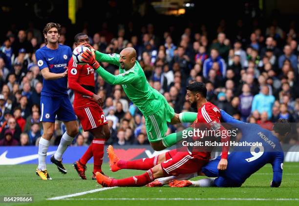 Heurelho Gomes of Watford saves infront of Miguel Britos of Watford and Alvaro Morata of Chelsea during the Premier League match between Chelsea and...