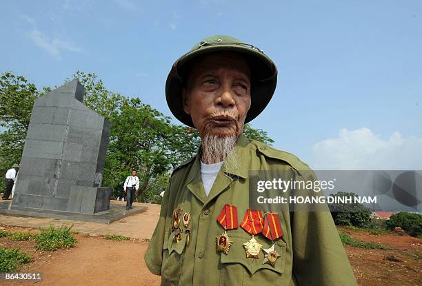 Eighty-eight-year-old Dien Bien Phu veteran Luu Ba Phat stands stands atop hill "Eliane 2" during a visit to the former French stronghold on May 6,...