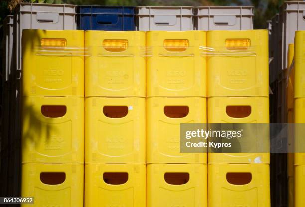 2017 - europe, greece, cyprus, limassol area, view of plastic beer crates stacked at brewery - crate fotografías e imágenes de stock