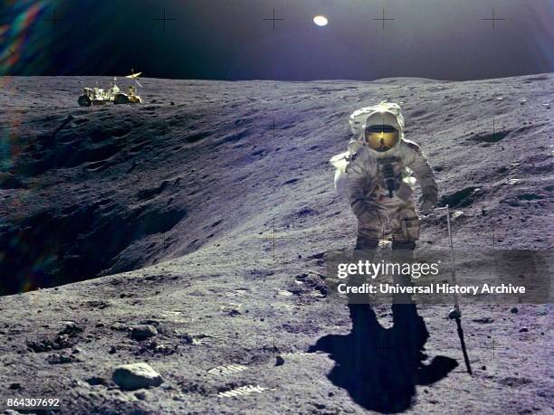 Astronaut Charles M. Duke, Jr., lunar module pilot of the Apollo 16 lunar landing mission, is photographed collecting lunar samples at Station no. 1...