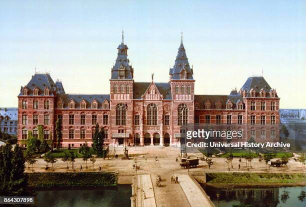 Photomechanical print dated to 1900, depicting the Rijksmuseum, Amsterdam; Holland. The Rijksmuseum is a Dutch national museum dedicated to arts and...