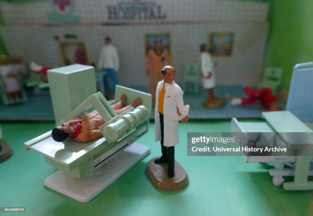 Dolls house Hospital showing patient, X-ray and other equipment.