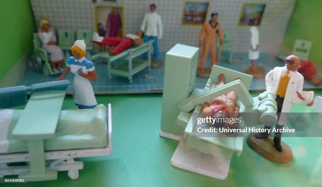 Dolls house Hospital showing patient, X-ray and other equipment.