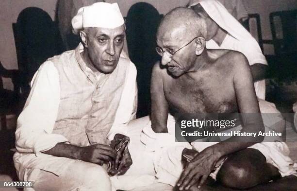Pandit Jawaharlal Nehru, later Prime Minister of India, with Mohandas Karamchand Gandhi , the preeminent leader of the Indian independence movement...