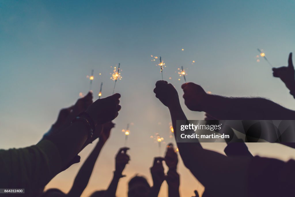 Friends celebrating New Year on the rooftop