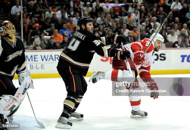 Goaltender Jonas Hiller and James Wisniewski of the Anaheim Ducks defend the goals against Tomas Holmstrom of the Detroit Red Wings during Game Three...