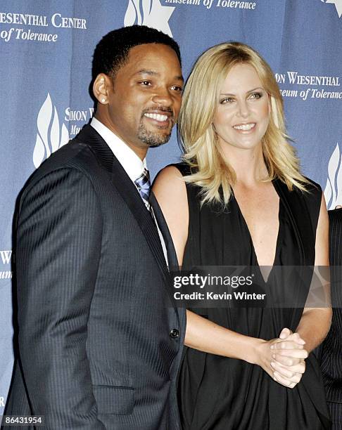 Actors Will Smith and Charlize Theron pose at the Simon Wiesenthal Center's Annual National Tribute Dinner at the Beverly Wilshire Hotel on May 5,...