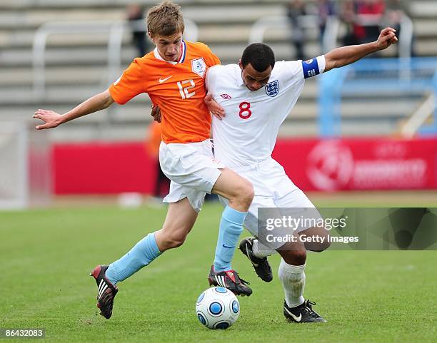 Joel Ivo Veltman of Netherlands and John Bostock of England battle for the ball during the UEFA U17 European Championship match between England and...