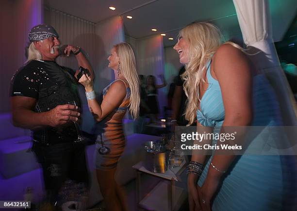 Hulk Hogan, Jennifer McDaniel and Brooke Hogan attend PURE Nightclub on May 5, 2009 in Las Vegas, NV.