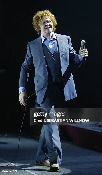 British singer and songwriter Mick Hucknall, lead singer of the band Simply Red, performs on stage during a concert part of his "Greatest-Hits" tour...