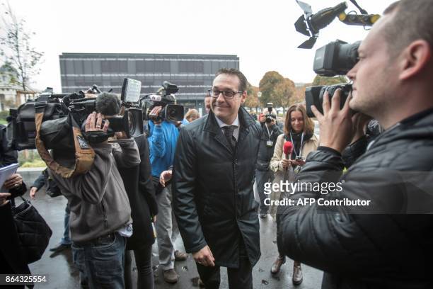 Chairman of the Austrian Freedom Party Heinz-Christian Strache is surrounded by journalists as he arrives for talks with Foreign Minister and...