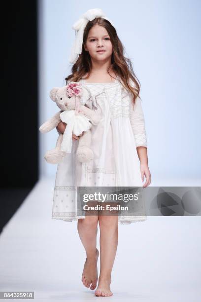 Model walks the runway at the Collective Show Alta Costura fashion show during day one of Mercedes Benz Fashion Week Russia S/S 2018 at Manege on...