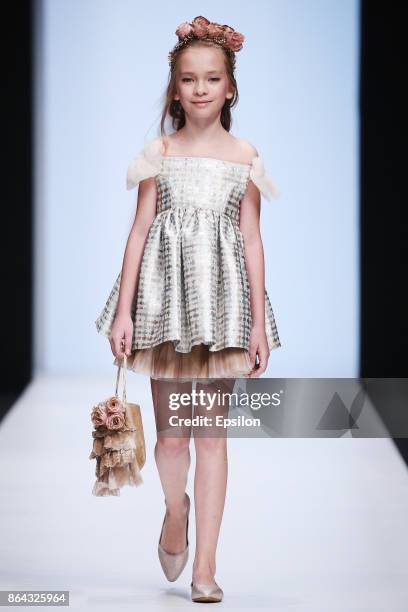 Model walks the runway at the Collective Show Alta Costura fashion show during day one of Mercedes Benz Fashion Week Russia S/S 2018 at Manege on...