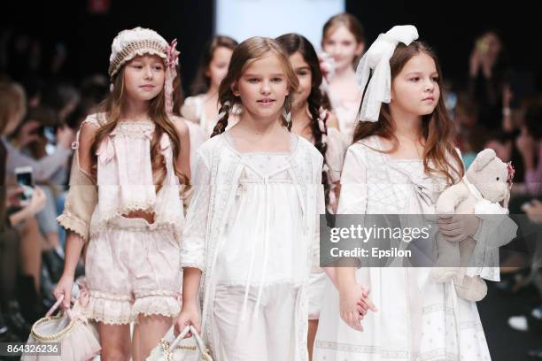 Model walks the runway at the Collective Show Alta Costura fashion show during day one of Mercedes Benz Fashion Week Russia S/S 2018 at Manege on...