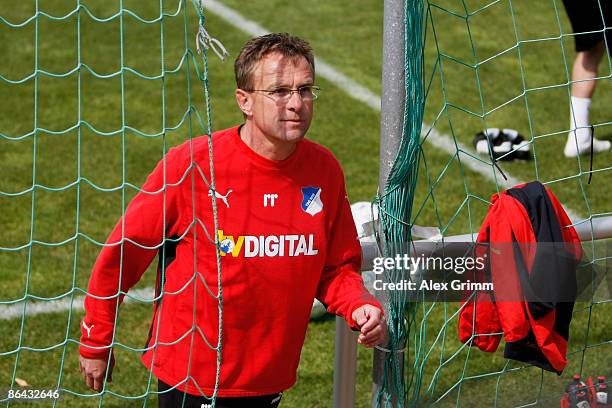 Head coach Ralf Rangnick walks off the pitch during a training session of 1899 Hoffenheim at the club's training center on May 6, 2009 in Sinsheim,...