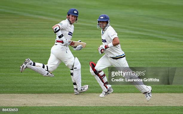 Jacques Rudolph and Joe Sayers of Yorkshire pile on the runs during the LV County Championship Division One match between Warwickshire and Yorkshire...