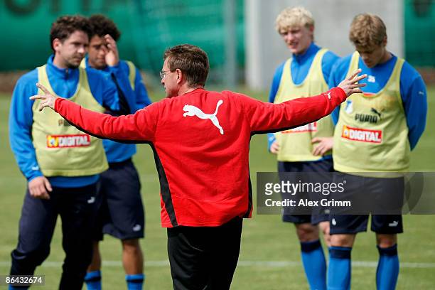 Head coach Ralf Rangnick issues instructions to his team during a training session of 1899 Hoffenheim at the club's training center on May 6, 2009 in...