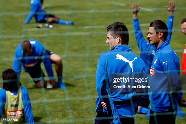 Vedad Ibisevic chats with team mate Sejad Salihovic during a training session of 1899 Hoffenheim at the club's training center on May 6, 2009 in...