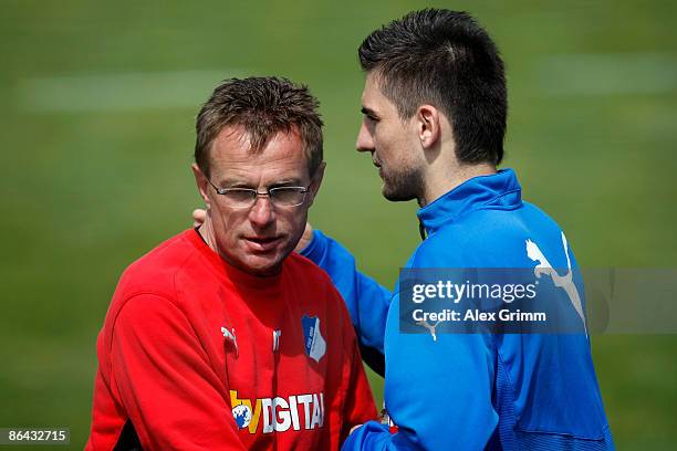 Head coach Ralf Rangnick talks to Vedad Ibisevic during a training session of 1899 Hoffenheim at the club's training center on May 6, 2009 in...