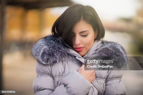 feeling warmth and cosiness - down coat stock pictures, royalty-free photos & images