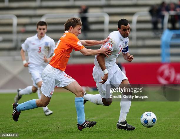 Joel Ivo Veltman of Netherlands and John Bostock of England battle for the ball during the UEFA U17 European Championship between England and...