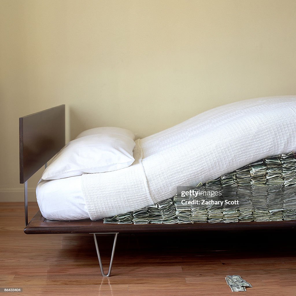 Money hidden under Modern bed mattress