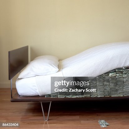 Money hidden under Modern bed mattress Money hidden under Modern bed mattress
