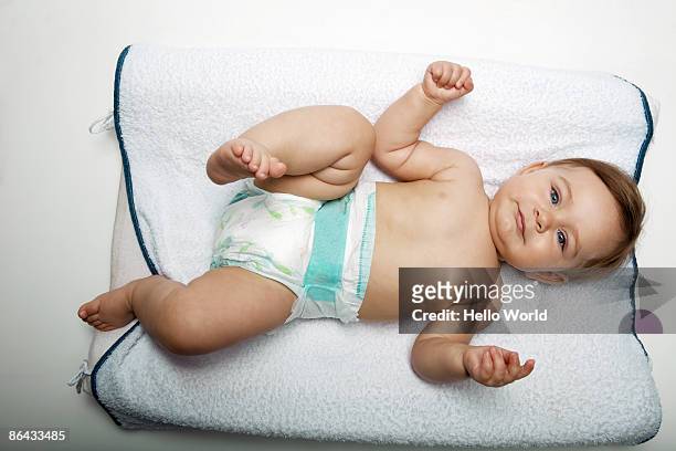 happy baby lying on her back - auf dem rücken liegen stock-fotos und bilder