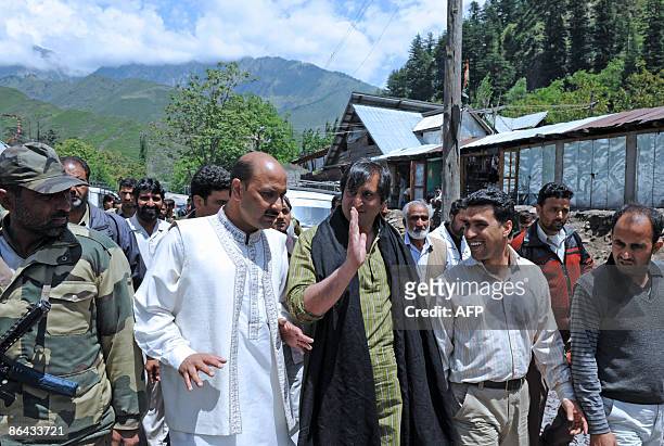 Chairman of the Jammu and Kashmir People's Conference Sajad Gani Lone a candidate for India's general elections, walks during a election campaign...