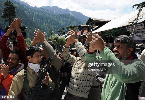 Activists from the Jammu and Kashmir People's Conference shout during a election campaign rally in Uri some 98kms north of Srinagar on May 6, 2009. A...