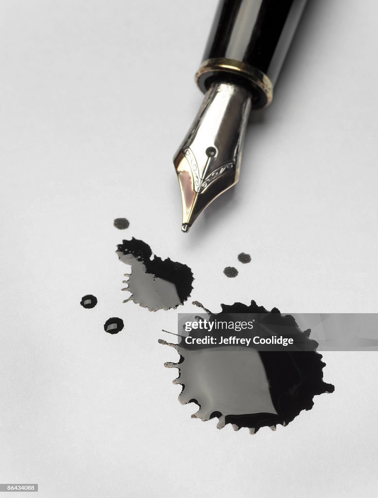 Small Ink Spill Ink Spill And Pen High-Res Stock Photo - Getty Images