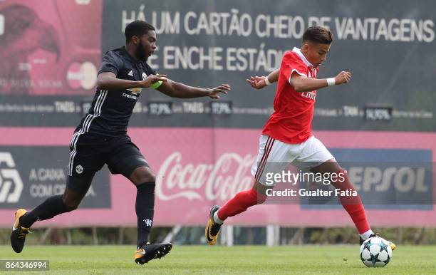 Benfica goalkeeper Celton Biai with Manchester United FC defender Ro-Shaun Williams in action during the UEFA Youth League match between SL Benfica...