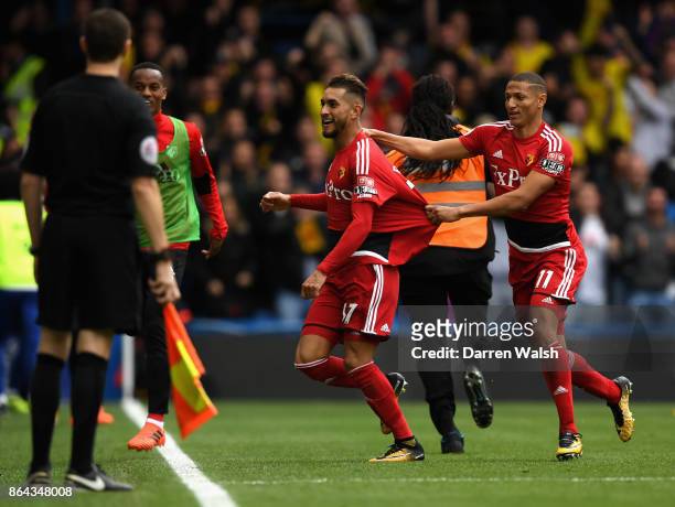 Roberto Pereyra celebrates scoring his side's second goal with Richarlison de Andrade of Watford during the Premier League match between Chelsea and...