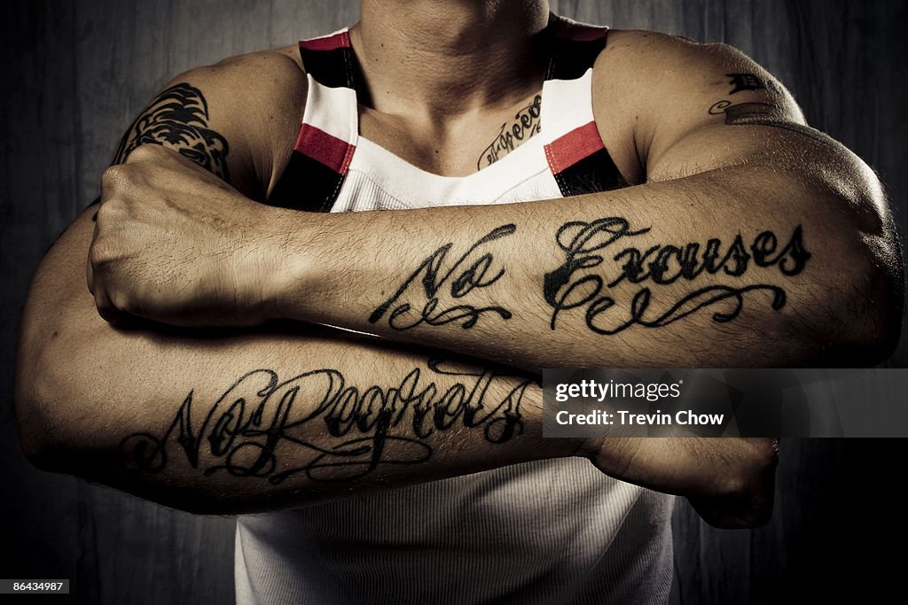 Man with tattoos on forearms