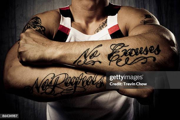 man with tattoos on forearms - human arm photos et images de collection